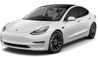 A sleek white Tesla Model 3 with black alloy wheels and a black roof, showcasing its aerodynamic design and modern electric vehicle aesthetics.